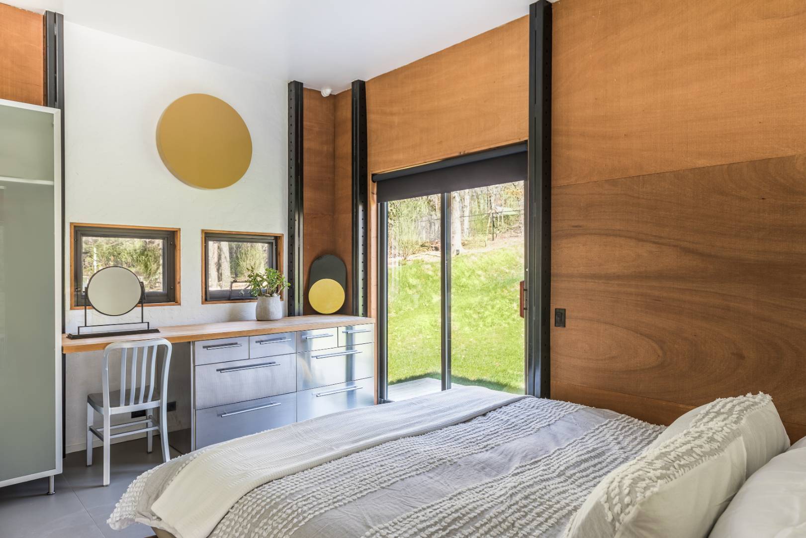 131 Windward East Hampton, NY 11937 - Photo 7 of 22 a bedroom with a bed lamps and a large window