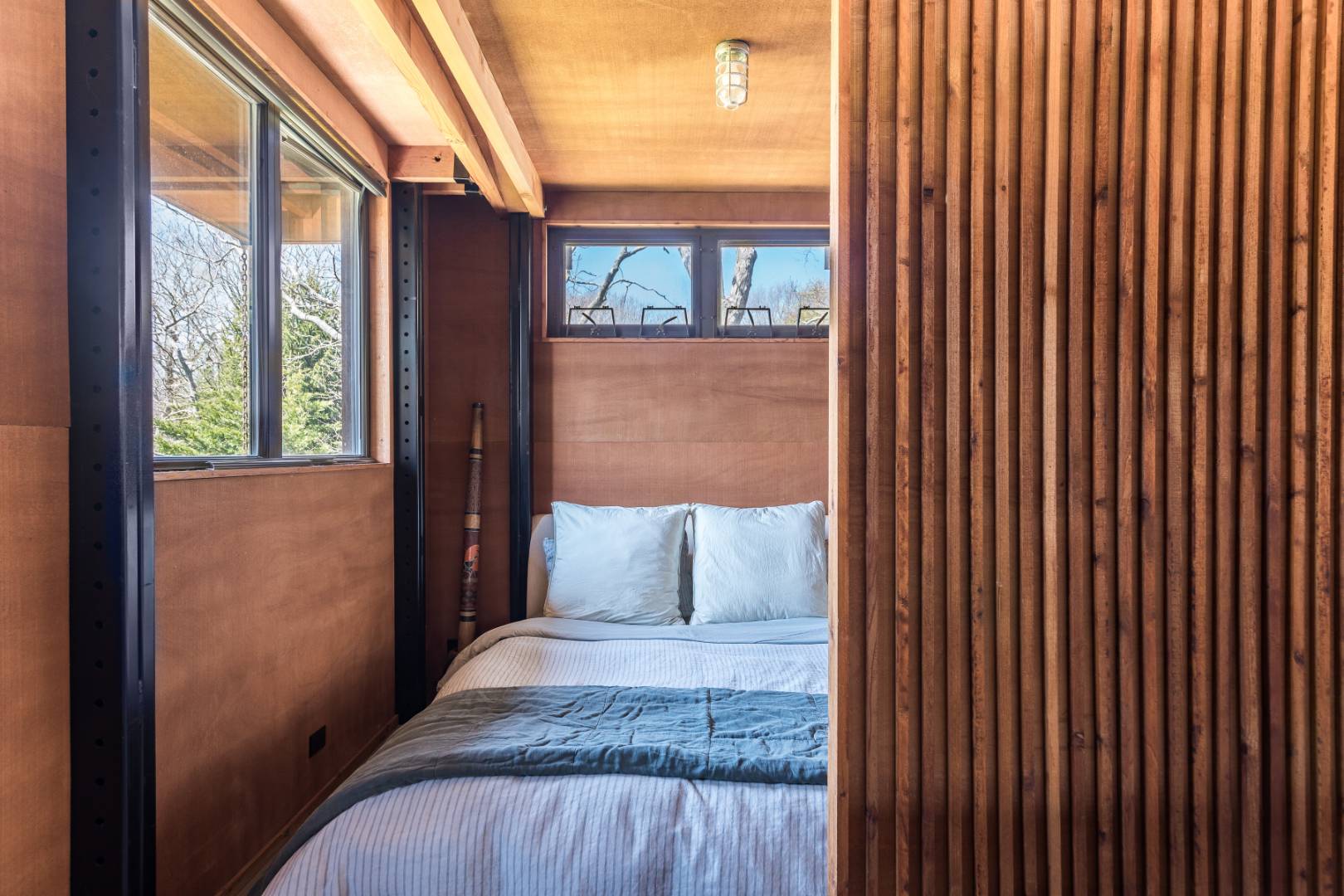 131 Windward East Hampton, NY 11937 - Photo 10 of 22 a bedroom with a bed and a window