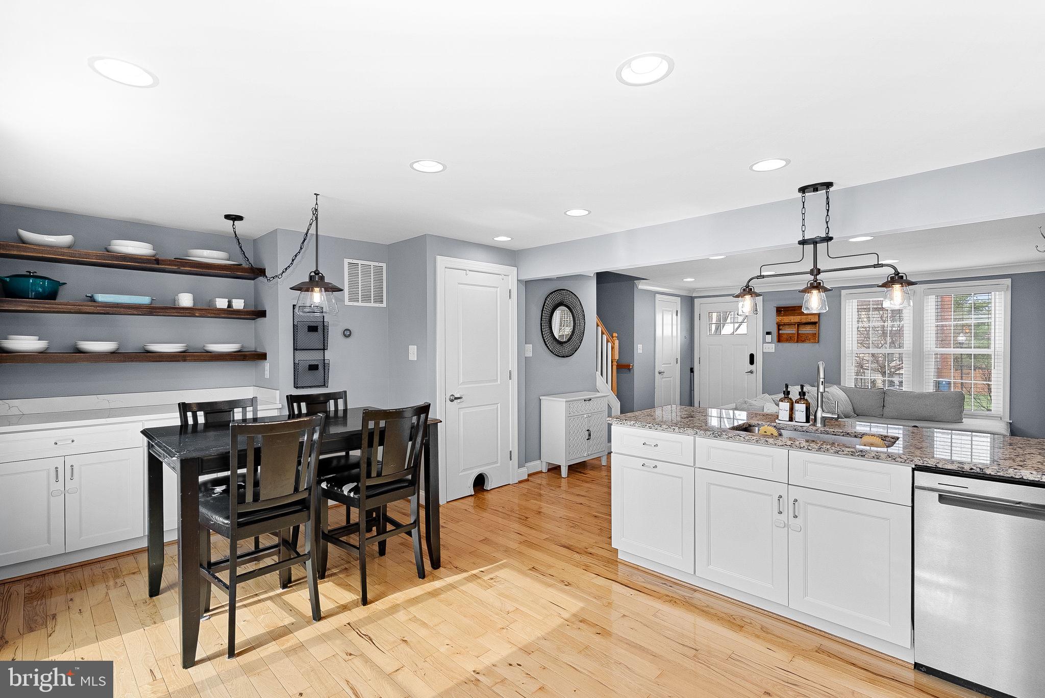 43983 Choptank Terrace Ashburn, VA 20147 - Photo 12 of 43 a large kitchen with a table and chairs