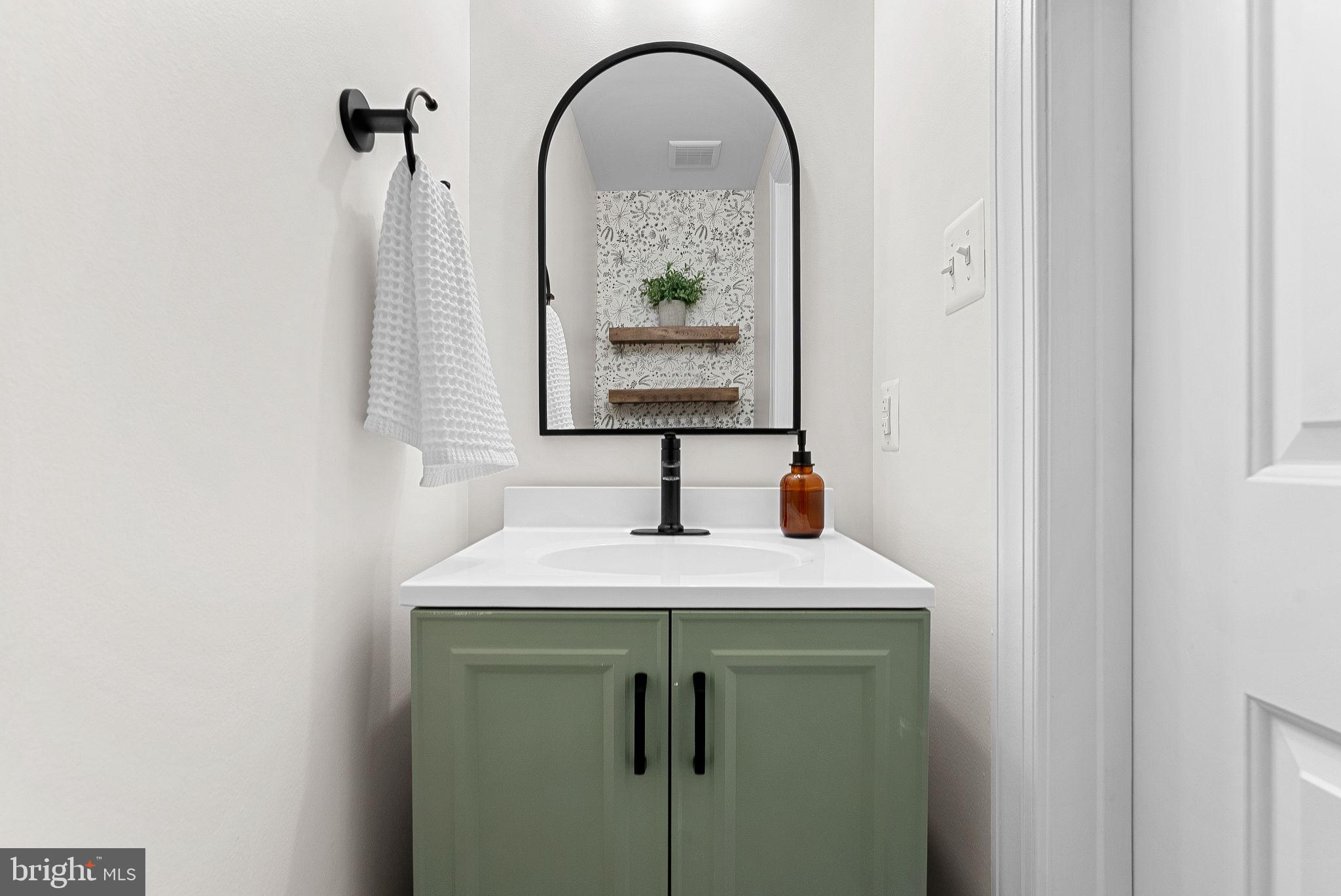 43983 Choptank Terrace Ashburn, VA 20147 - Photo 15 of 43 a bathroom with a sink and a mirror