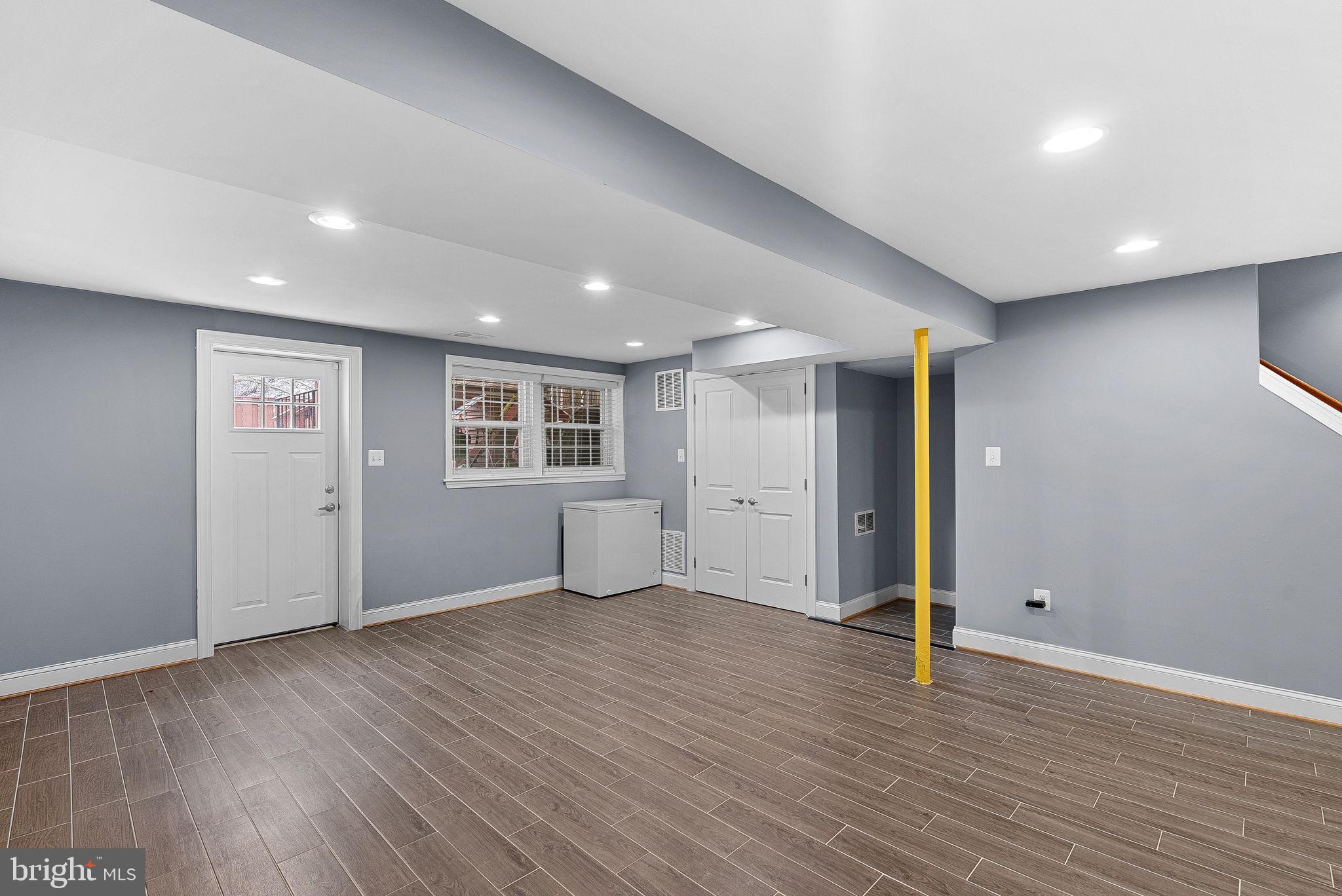 43983 Choptank Terrace Ashburn, VA 20147 - Photo 27 of 43 a view of an empty room with wooden floor and closet