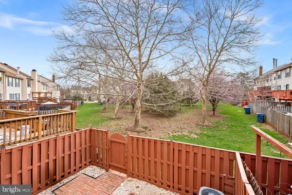 a view of a wooden deck with a yard