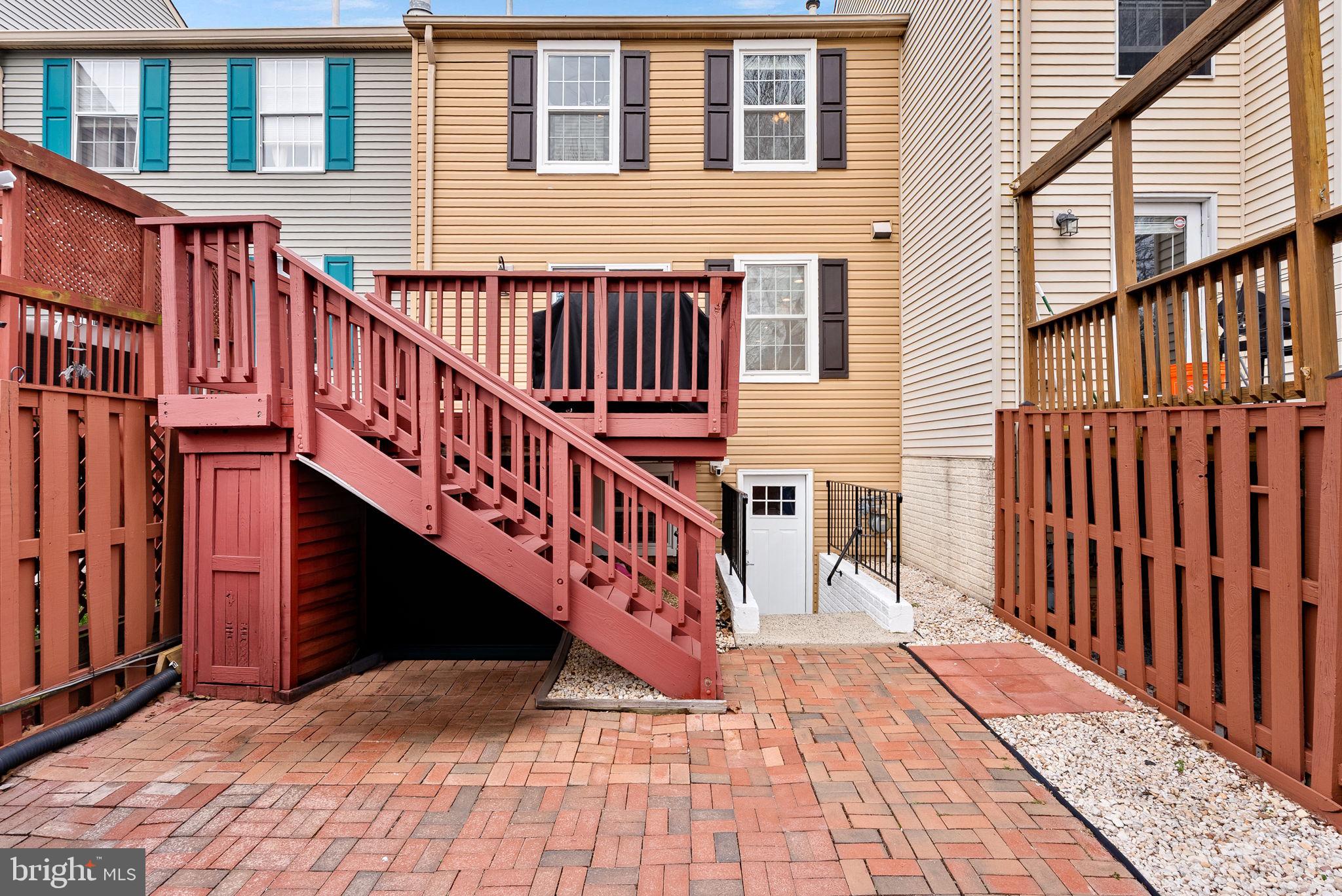 43983 Choptank Terrace Ashburn, VA 20147 - Photo 36 of 43 a view of a house with wooden deck stairs