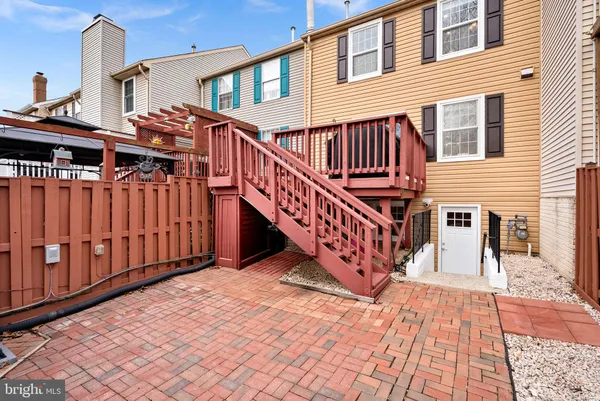 a view of a house with wooden deck