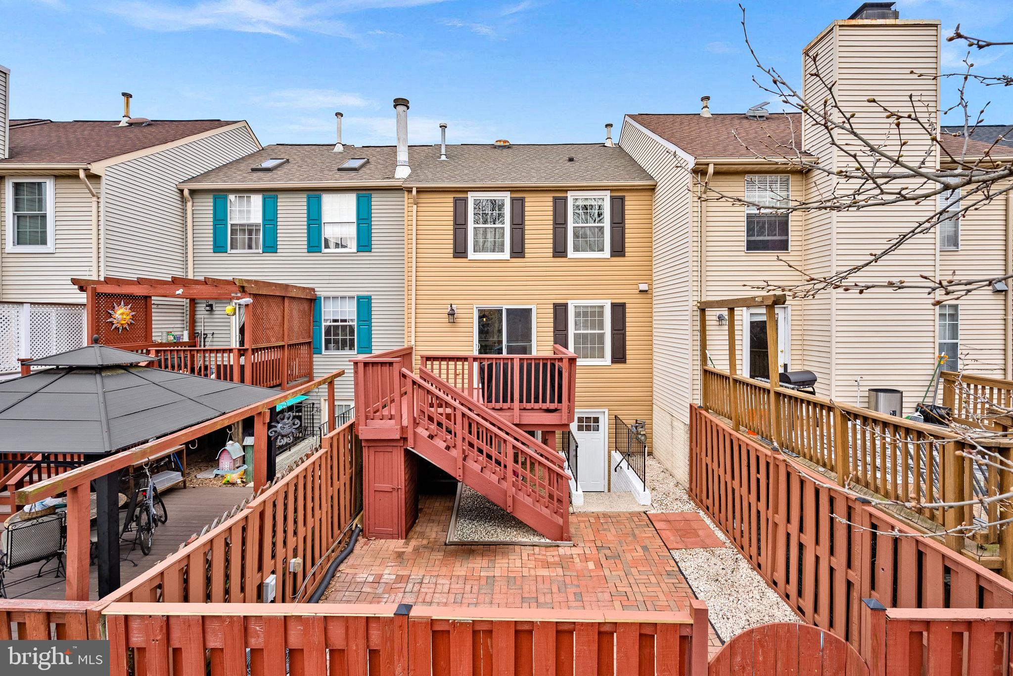 43983 Choptank Terrace Ashburn, VA 20147 - Photo 39 of 43 a view of a brick building with many windows