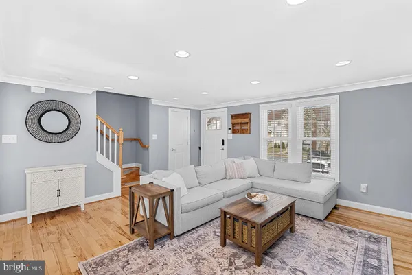 a living room with furniture and a rug