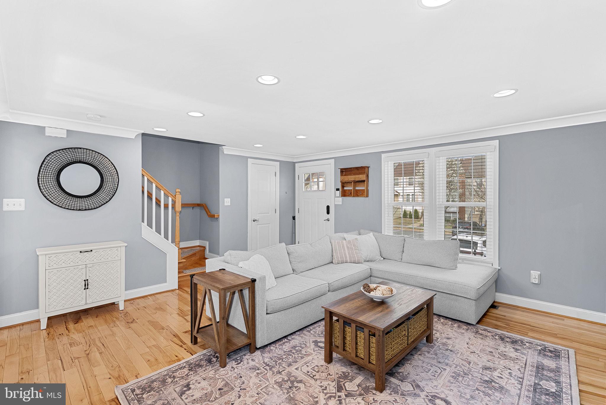 43983 Choptank Terrace Ashburn, VA 20147 - Photo 6 of 43 a living room with furniture and a rug