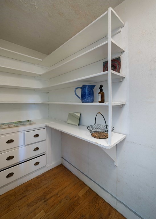 22 Liberty Street Northampton, MA 01062 - Photo 12 of 19 a kitchen with a white cabinets and wooden floor