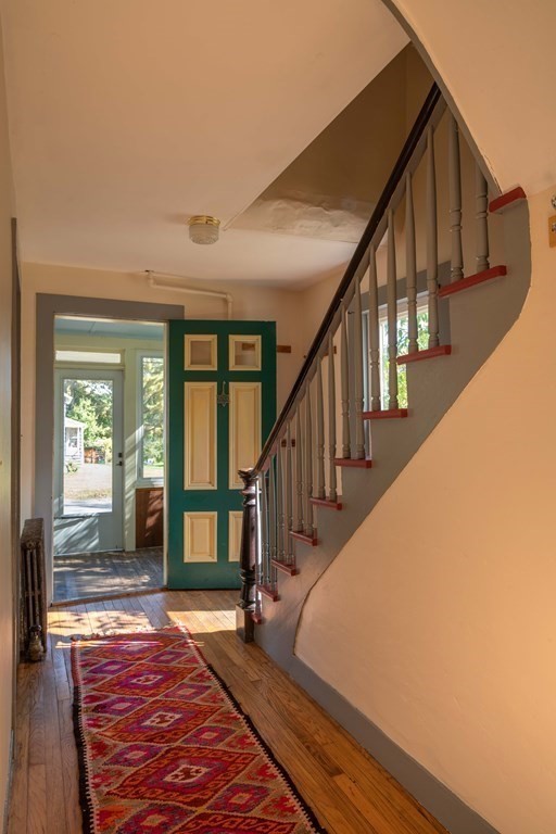 22 Liberty Street Northampton, MA 01062 - Photo 13 of 19 a view of staircase with wooden floor and a rug