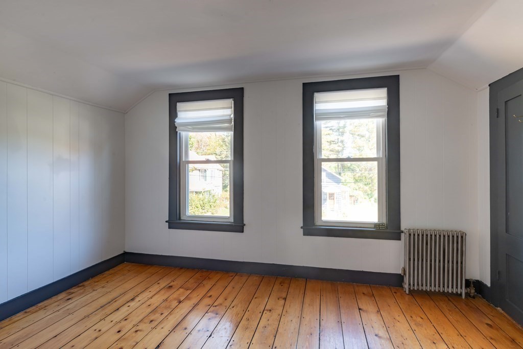 22 Liberty Street Northampton, MA 01062 - Photo 15 of 19 an empty room with wooden floor and windows