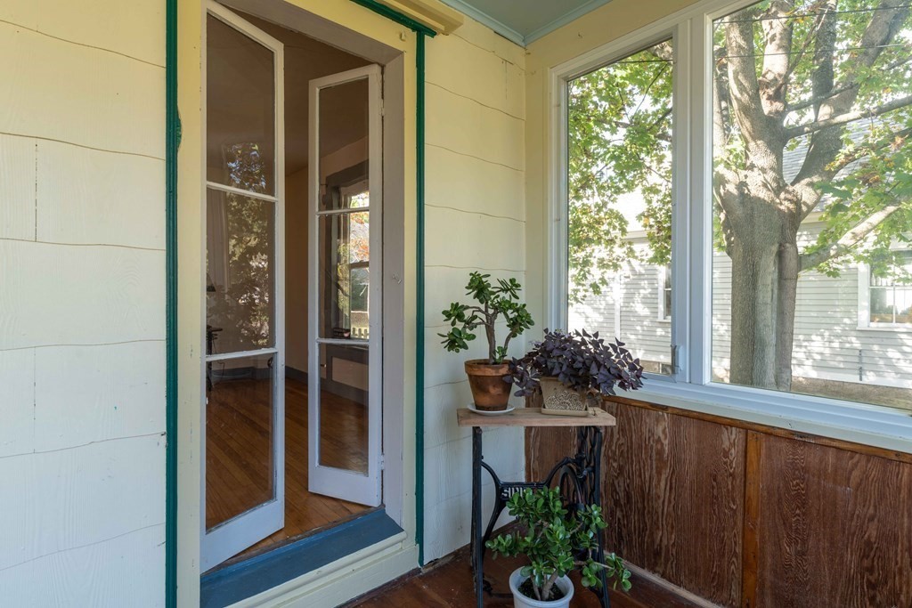 22 Liberty Street Northampton, MA 01062 - Photo 4 of 19 a porch with seating space and yard