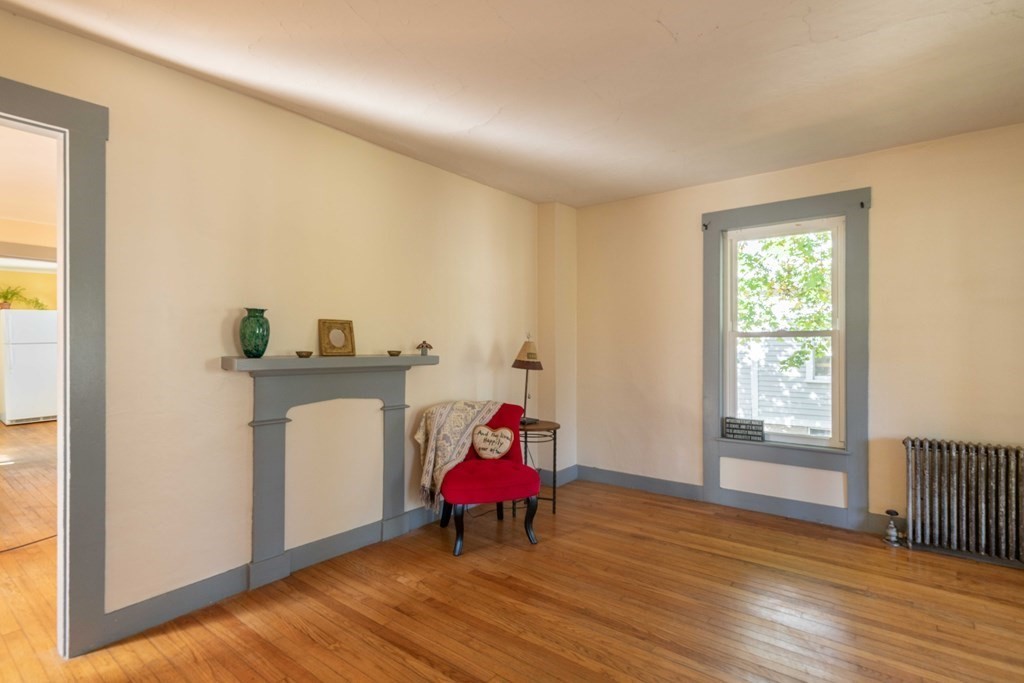 22 Liberty Street Northampton, MA 01062 - Photo 6 of 19 a room with furniture and wooden floor