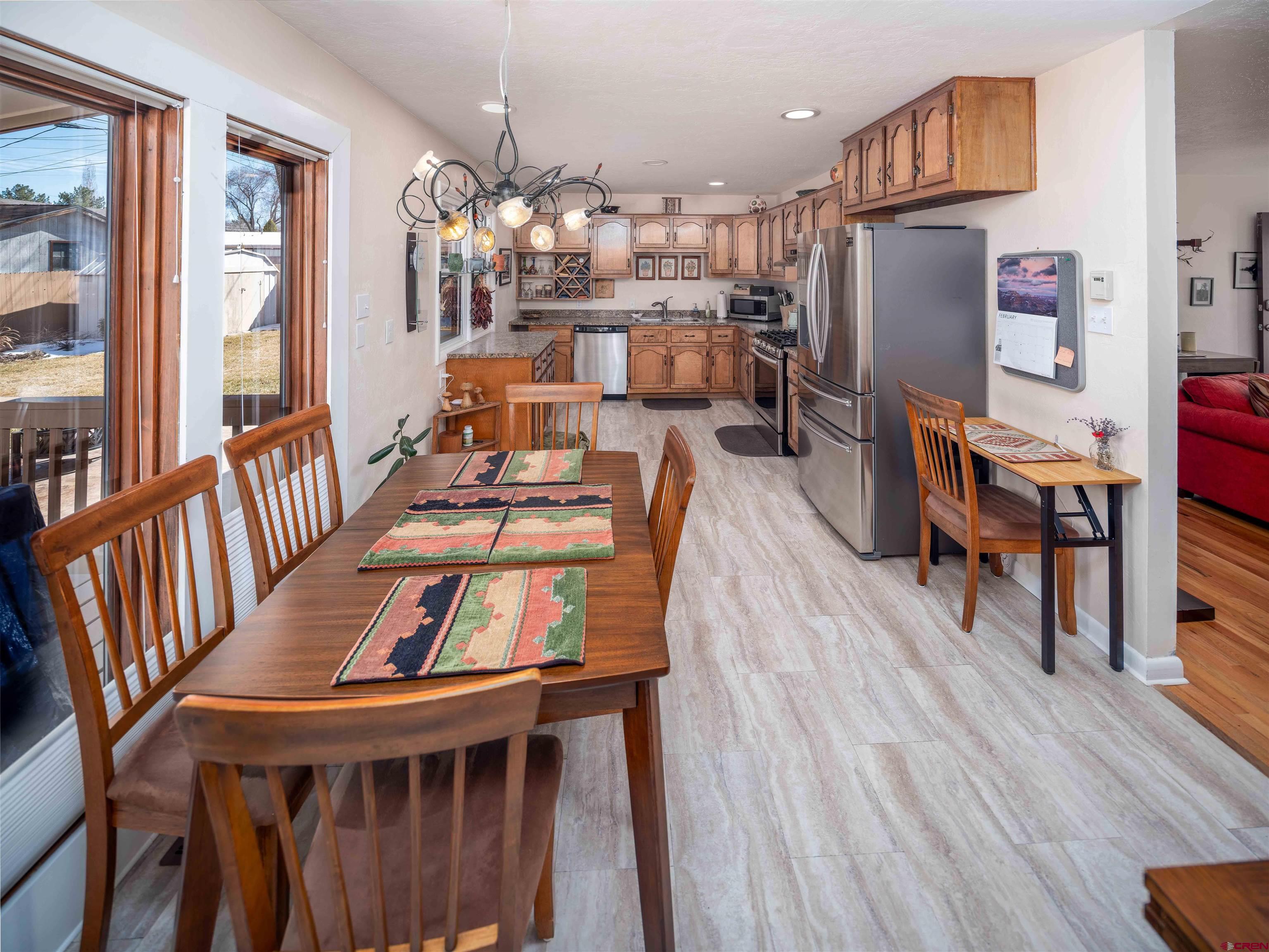 710 Wedgewood Street Cortez, CO 81321 - Photo 11 of 30 a view of a dining room with furniture and wooden floor