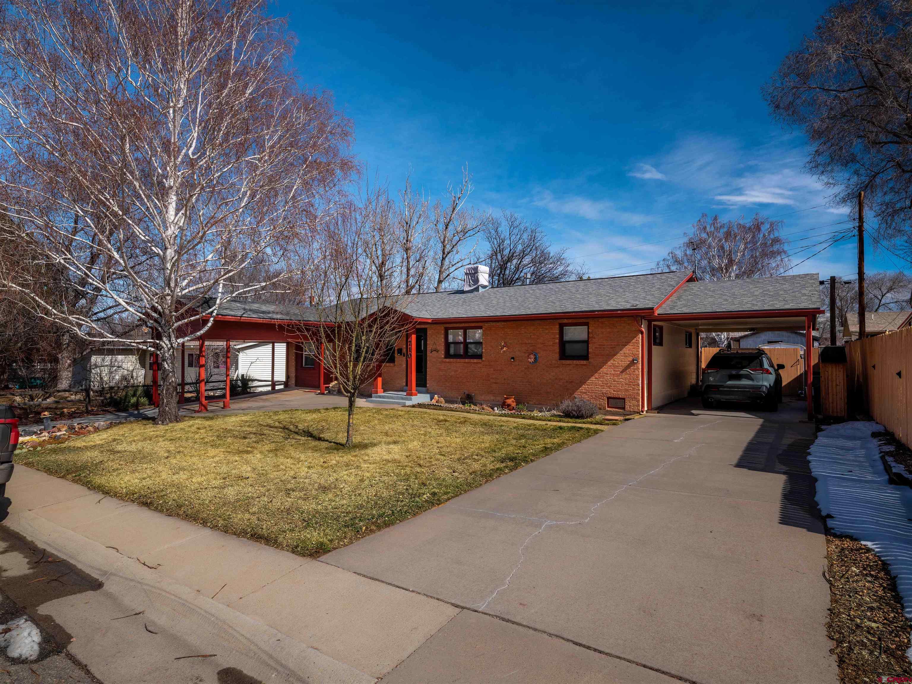 710 Wedgewood Street Cortez, CO 81321 - Photo 2 of 30 a front view of a house with garden