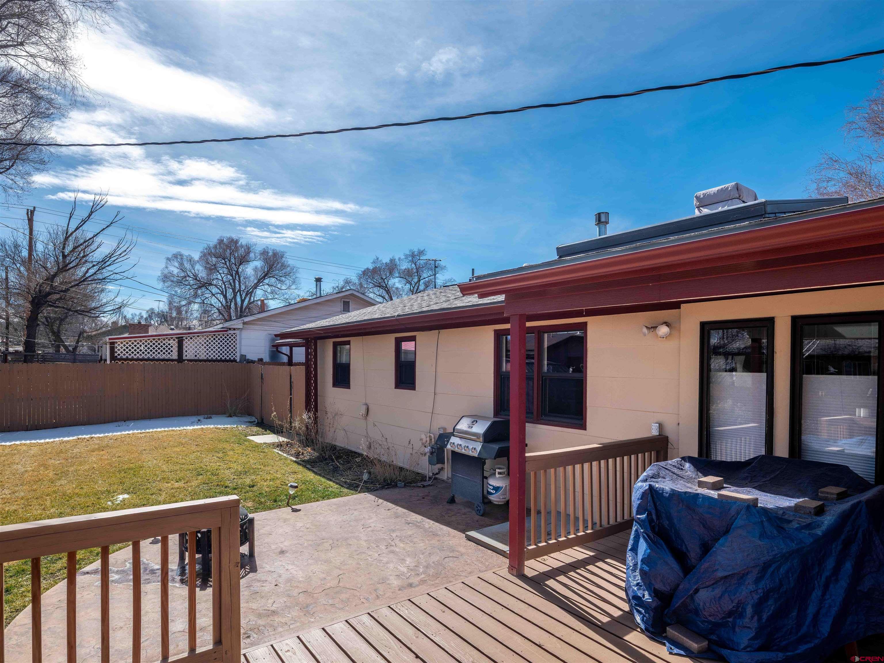 710 Wedgewood Street Cortez, CO 81321 - Photo 28 of 30 a view of house with backyard outdoor seating and barbeque oven