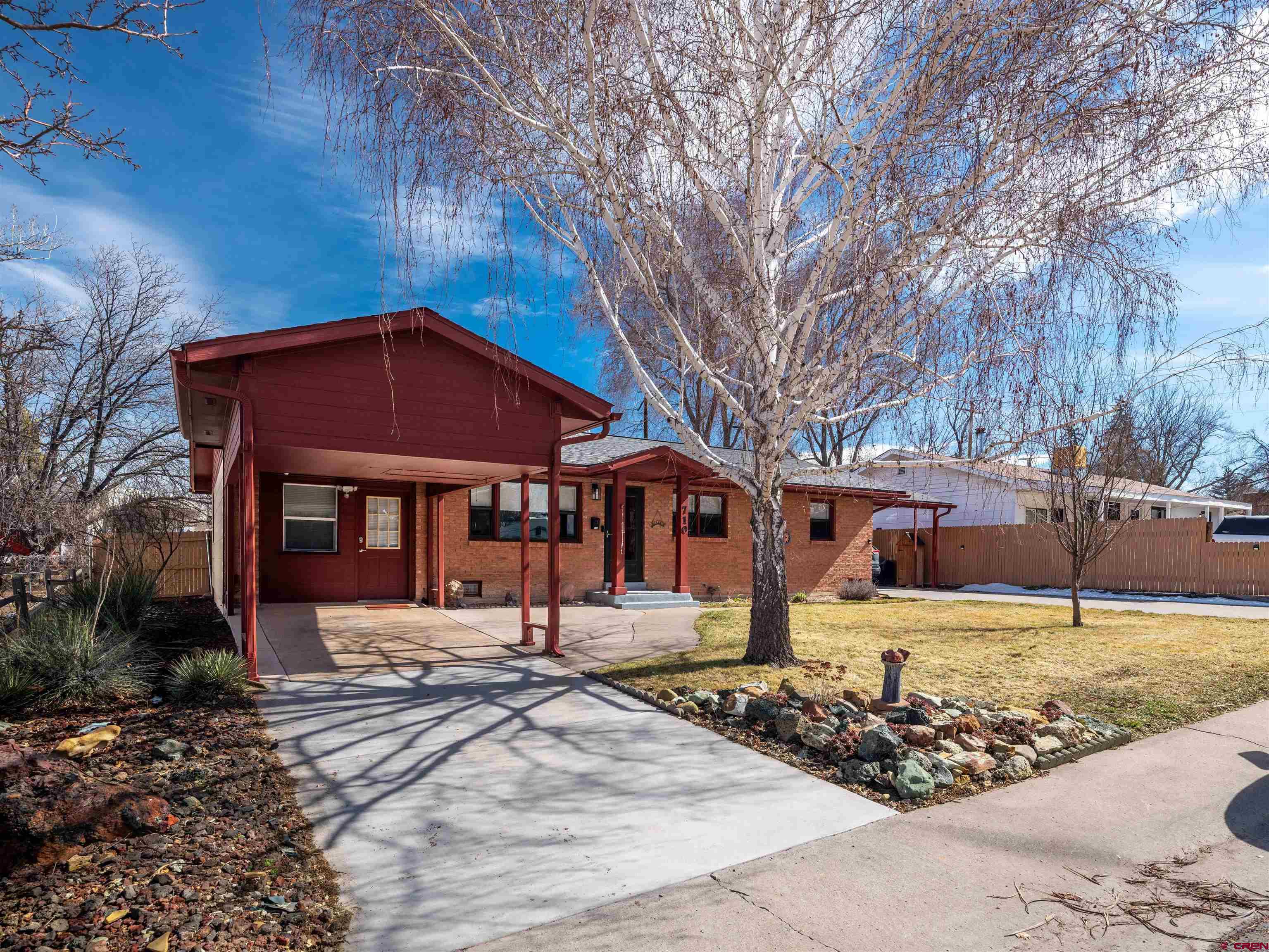 710 Wedgewood Street Cortez, CO 81321 - Photo 4 of 30 a front view of a house with a yard
