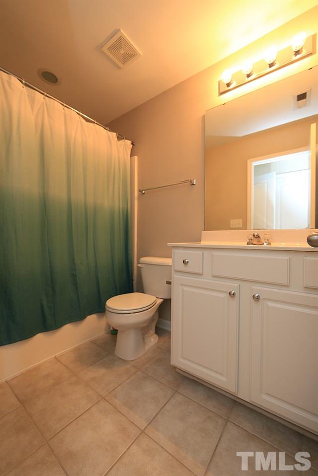 3715 Ramblewood Avenue Durham, NC 27713 - Photo 18 of 22 a bathroom with a toilet sink and mirror