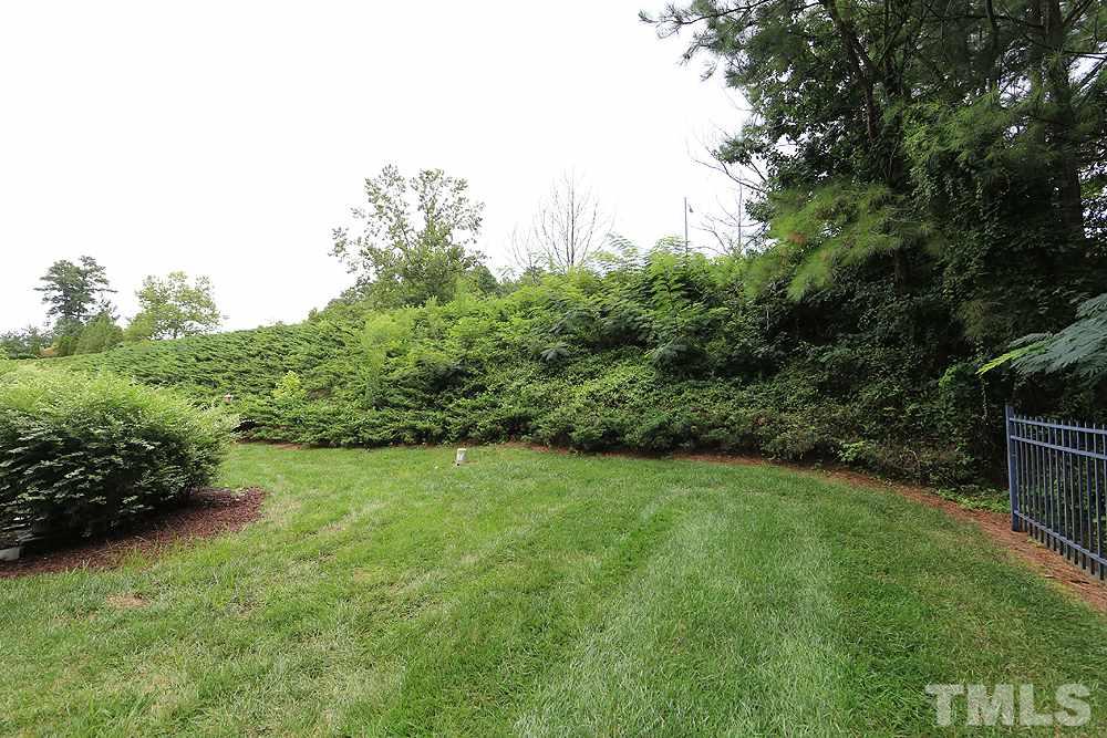 3715 Ramblewood Avenue Durham, NC 27713 - Photo 21 of 22 a view of a grassy field with trees