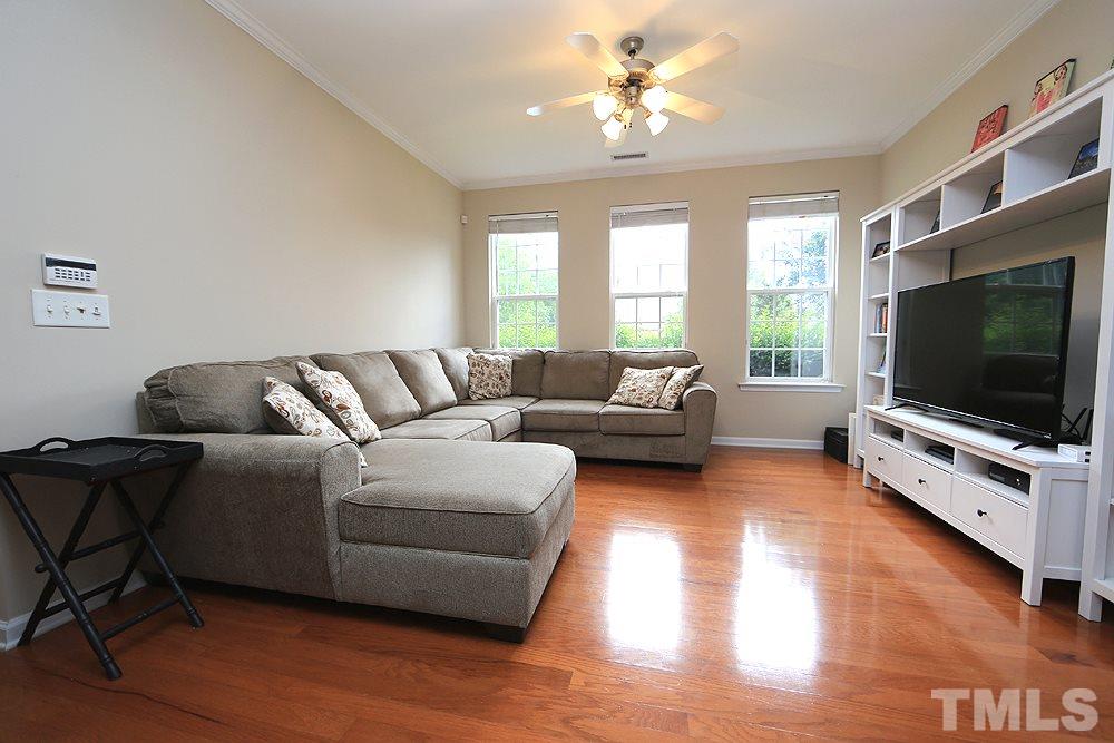 3715 Ramblewood Avenue Durham, NC 27713 - Photo 6 of 22 a living room with furniture and a flat screen tv