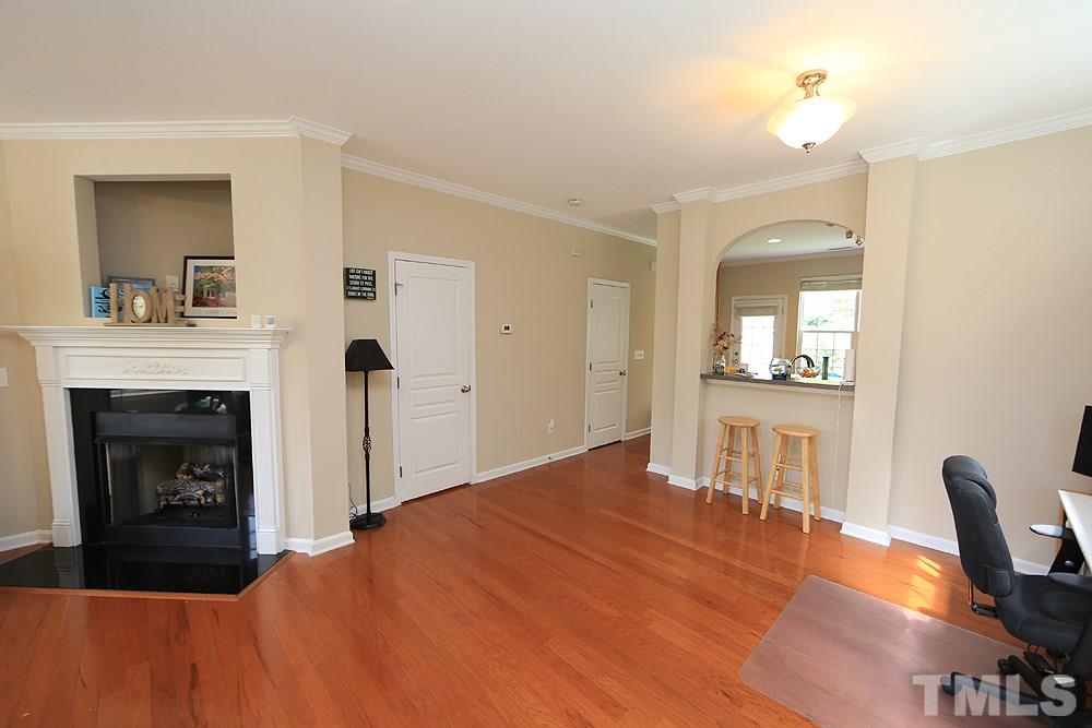 3715 Ramblewood Avenue Durham, NC 27713 - Photo 10 of 22 a bedroom with a bed and a fireplace