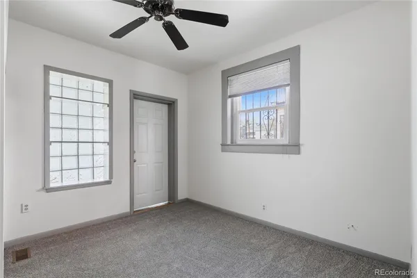 a view of empty room with windows