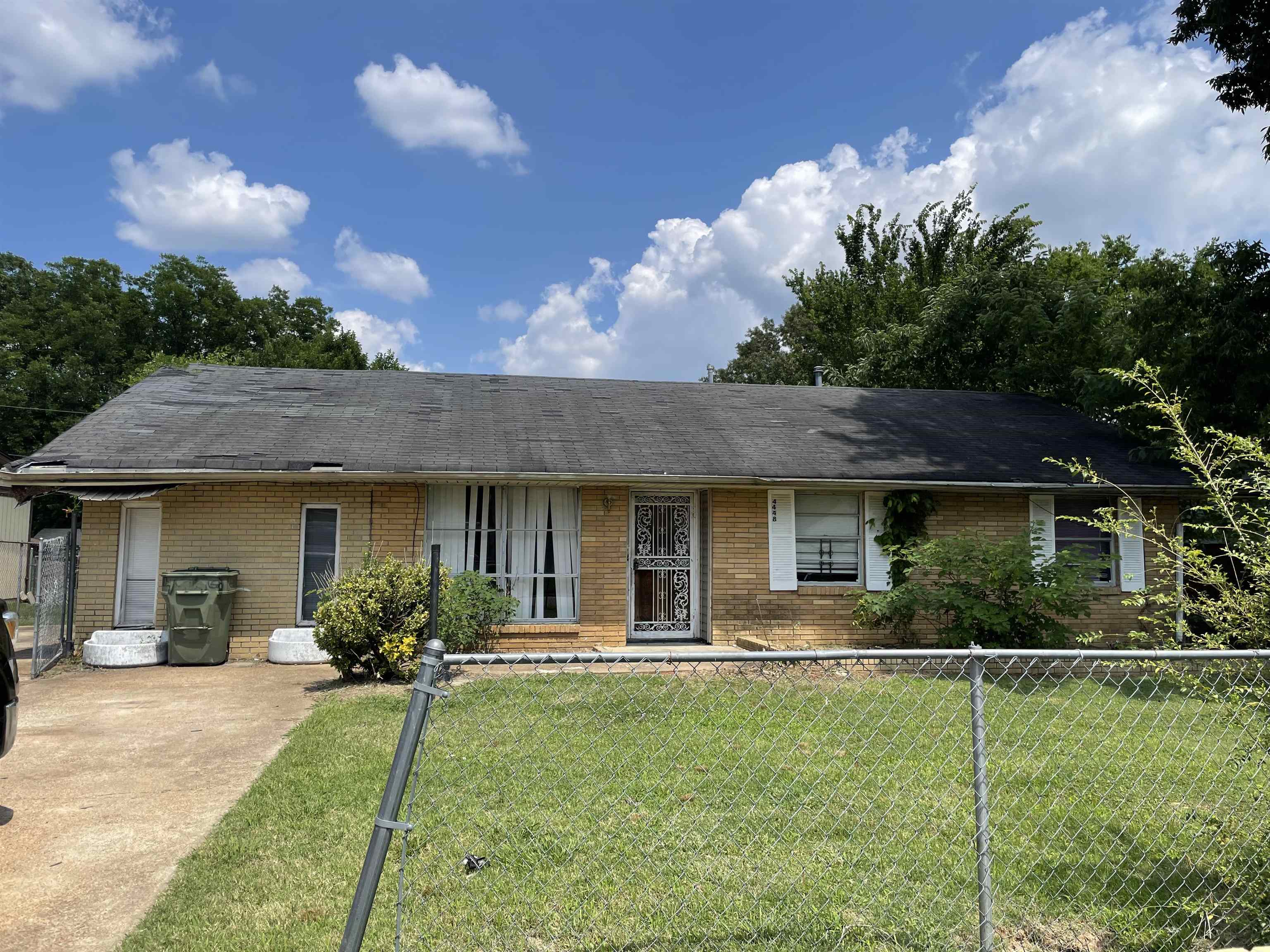 4448 Bluebell Street Memphis, TN 38109 - Photo 1 of 18 a house view with a garden space