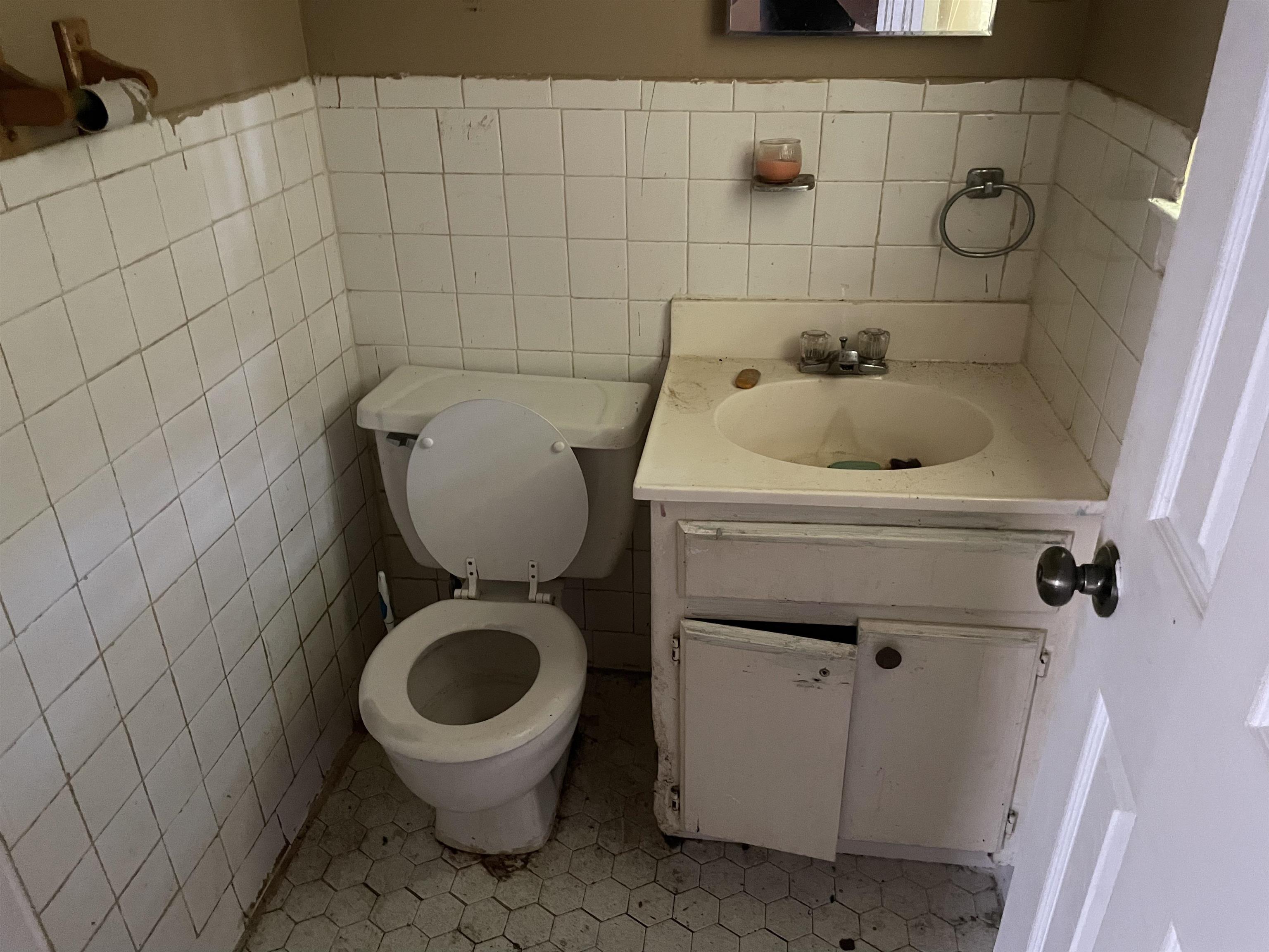 4448 Bluebell Street Memphis, TN 38109 - Photo 17 of 18 a bathroom with a sink and a toilet