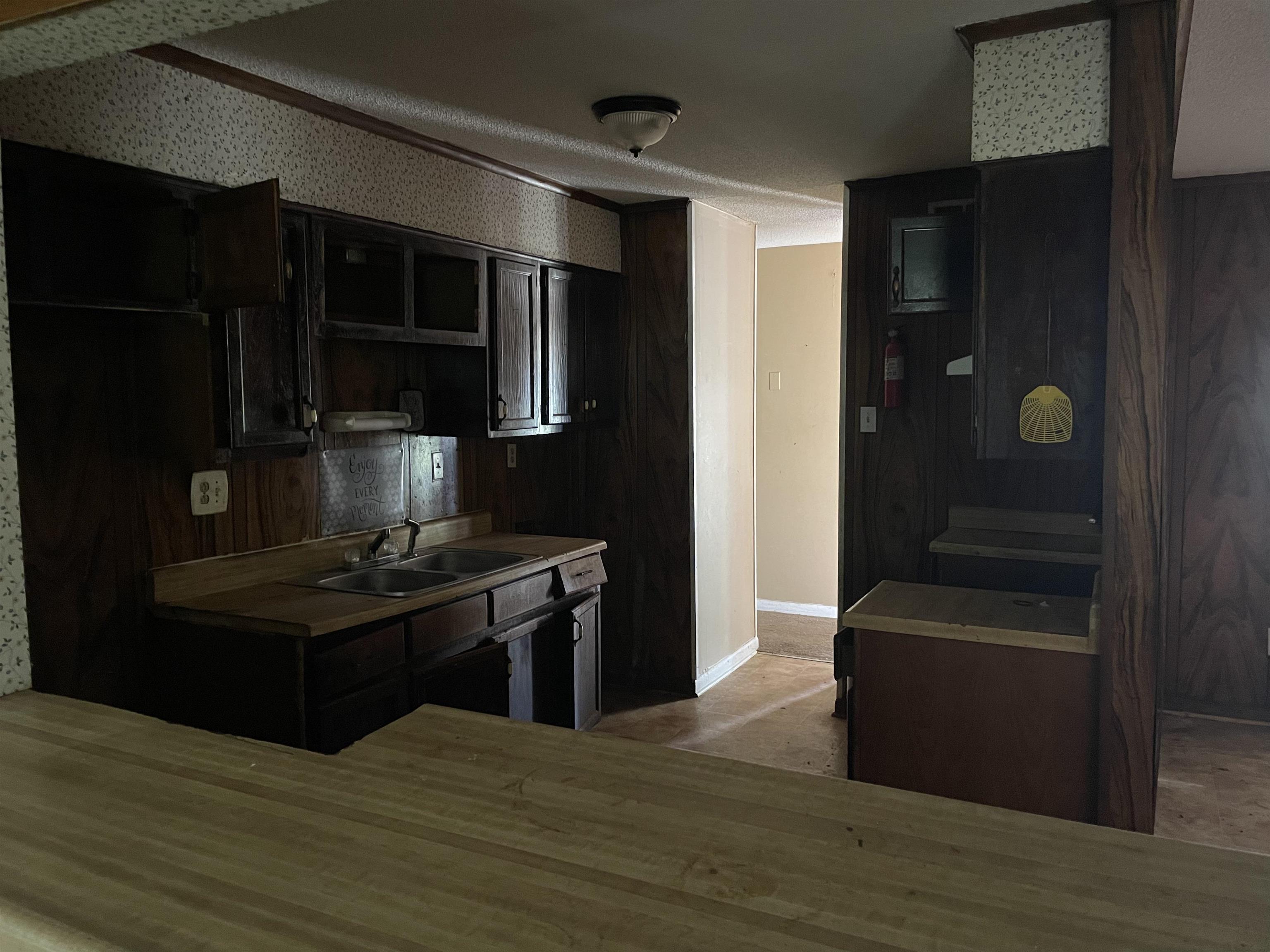 4448 Bluebell Street Memphis, TN 38109 - Photo 10 of 18 a kitchen with kitchen island stainless steel appliances a sink and stove