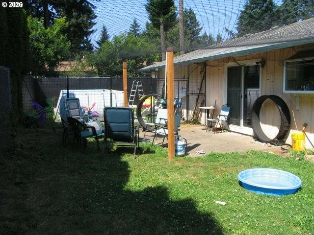 35 Northeast 157th Avenue Portland, OR 97230 - Photo 11 of 30 a backyard of a house with yard and outdoor seating