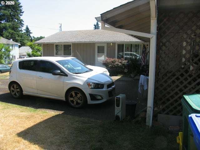 35 Northeast 157th Avenue Portland, OR 97230 - Photo 13 of 30 a car parked in front of a house