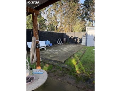 35 Northeast 157th Avenue Portland, OR 97230 - Photo 15 of 30 a backyard of a house with table and chairs