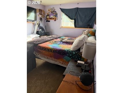 35 Northeast 157th Avenue Portland, OR 97230 - Photo 17 of 30 a bed sitting in a bedroom next to a window