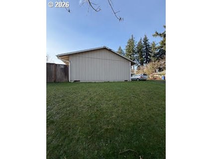 35 Northeast 157th Avenue Portland, OR 97230 - Photo 18 of 30 a yellow house with a yard