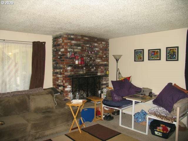 35 Northeast 157th Avenue Portland, OR 97230 - Photo 2 of 30 a workspace with furniture and rug