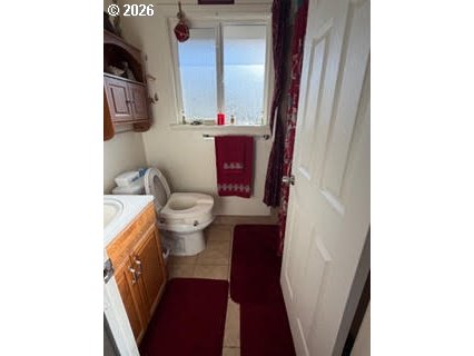 35 Northeast 157th Avenue Portland, OR 97230 - Photo 24 of 30 a bathroom with a toilet and a mirror