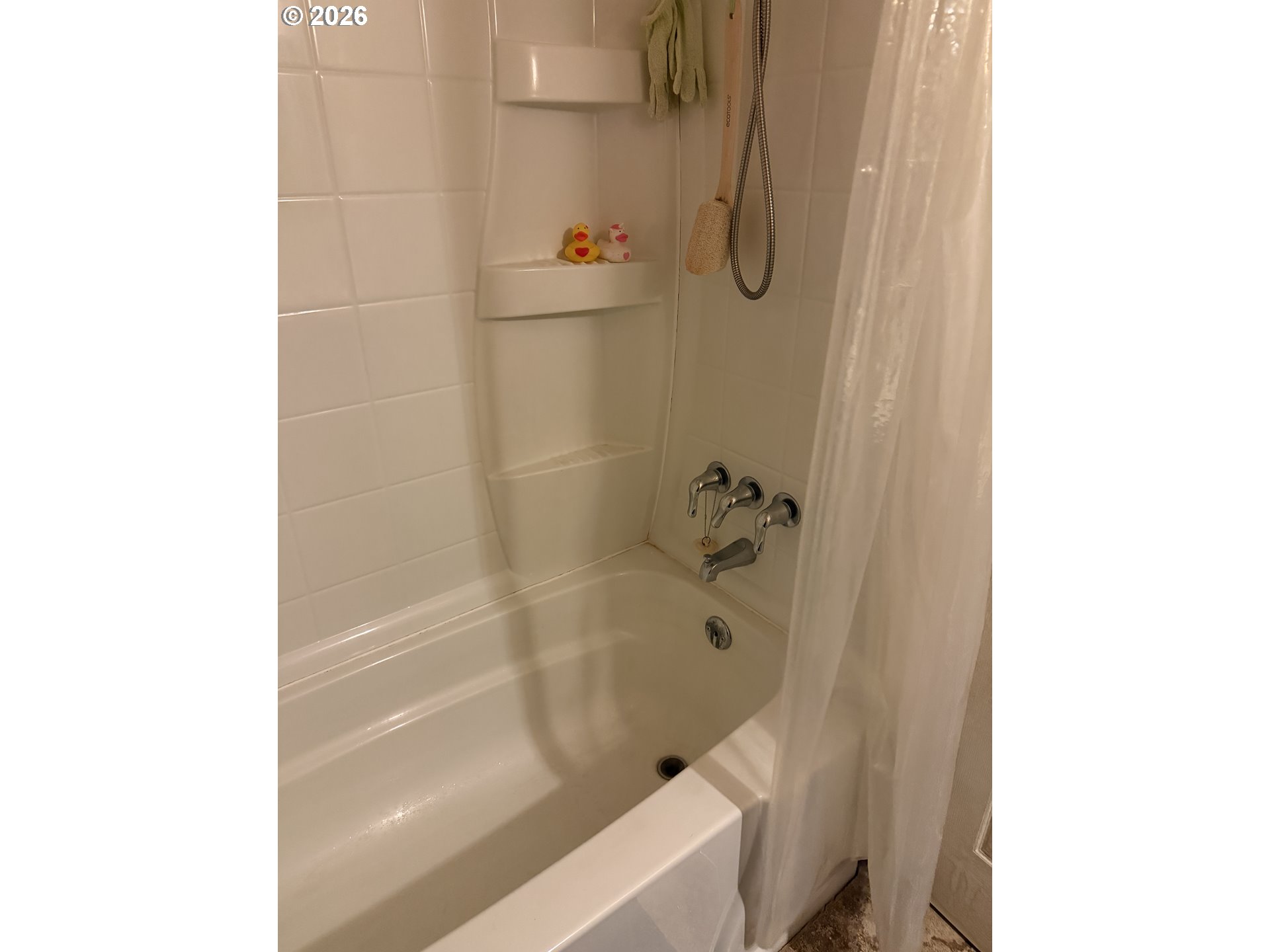 35 Northeast 157th Avenue Portland, OR 97230 - Photo 26 of 30 a bath tub sitting next to a white toilet