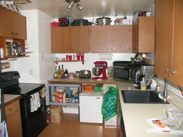 35 Northeast 157th Avenue Portland, OR 97230 - Photo 3 of 30 a kitchen with a table and chairs in it