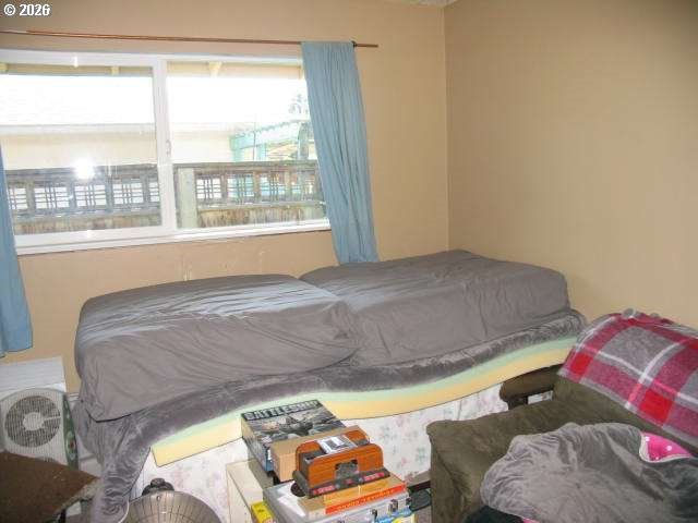 35 Northeast 157th Avenue Portland, OR 97230 - Photo 6 of 30 a bedroom with a bed and a window