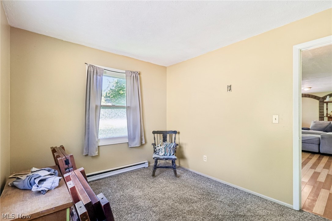 2960 Rome Rock Creek Road Rock Creek, OH 44084 - Photo 36 of 49 Carpeted room featuring a window with natural light, neutral wall paint, and white trim