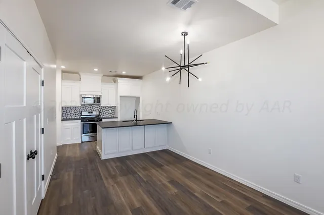 a room with a window and a ceiling fan