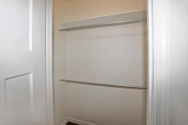 a view of a kitchen with a sink and wooden floor