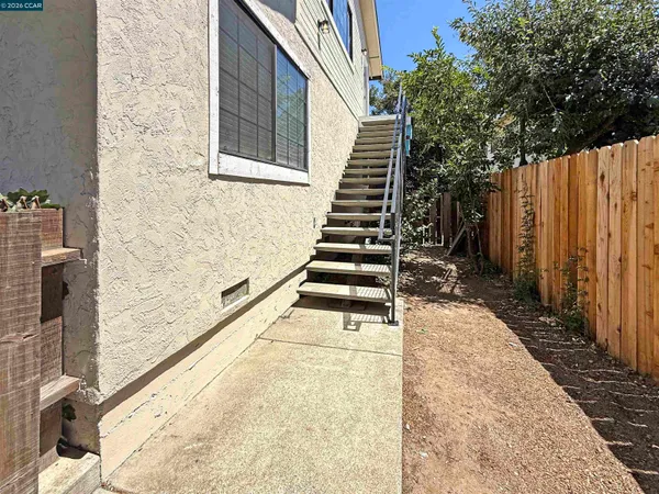 a balcony with view of the house