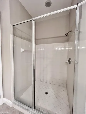 a large kitchen with stainless steel appliances granite countertop a stove a sink and a refrigerator