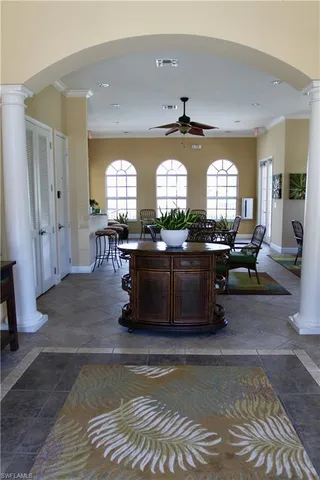 a view of a swimming pool with outdoor seating