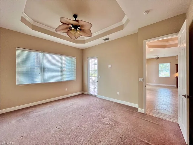 a bathroom with a granite countertop double vanity sink a mirror a bathtub and shower