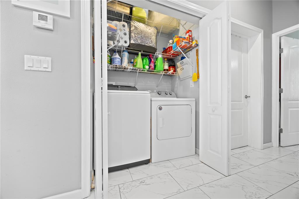 1890 Southwest 83rd Terrace Davie, FL 33324 - Photo 19 of 46 a view of storage and utility room with washer and dryer