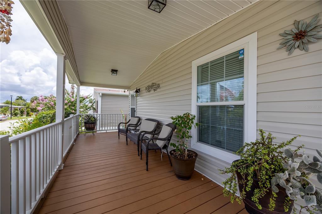 1890 Southwest 83rd Terrace Davie, FL 33324 - Photo 29 of 46 a view of a balcony with chairs and wooden fence