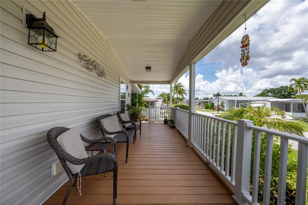 1890 Southwest 83rd Terrace Davie, FL 33324 - Photo 32 of 46 a view of a chairs and table in patio with wooden fence