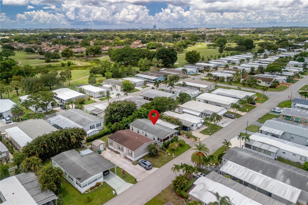 1890 Southwest 83rd Terrace Davie, FL 33324 - Photo 41 of 46 an aerial view of a houses with a yard