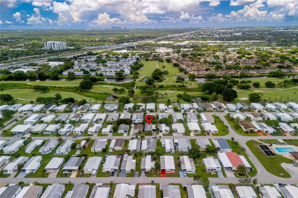 1890 Southwest 83rd Terrace Davie, FL 33324 - Photo 46 of 46 an aerial view of residential houses with outdoor space and swimming pool